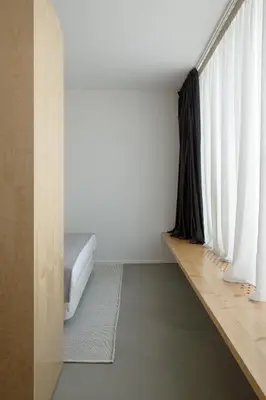 a bedroom with a bed and a large window at Urban Residences Sacadura in Porto