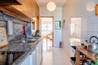 a kitchen with a sink and a counter at Skyline Invicta in Porto