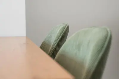 a green couch sitting next to a wooden table at Sunny one bedroom apartment in Porto