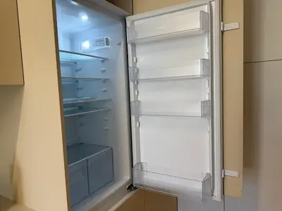 an empty refrigerator with its door open at Apartments City Center- Market Bolhão in Porto