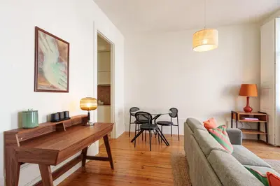 a living room with a couch and a table at VIVA Cedofeita Serviced Apartments in Porto
