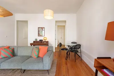 a living room with a couch and a table at VIVA Cedofeita Serviced Apartments in Porto