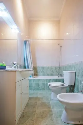 a bathroom with a toilet and a sink and a tub at Porto Pacific - Rua das Flores - Flower Street in Porto