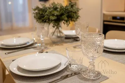 a dining room with a table and two chairs at Fado in Porto - Porto Velho Apt in Porto