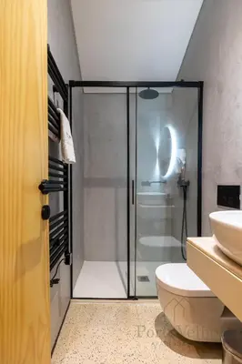 a room with a staircase and a mirror and a bed at Fado in Porto - Porto Velho Apt in Porto
