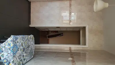 a kitchen with a large mirror and a counter at Apartamento Costa Cabral in Porto