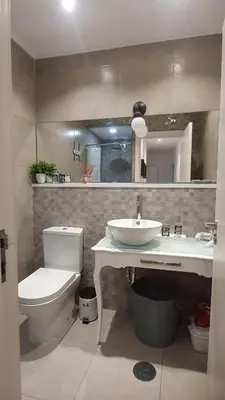 a bathroom with a toilet and a sink at T2P Pilar House in Vila Nova de Gaia