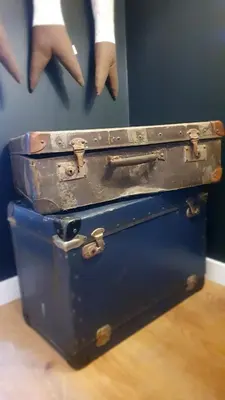 two old suitcases stacked on top of each other at T2P Pilar House in Vila Nova de Gaia