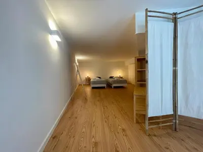 a room with a bed and a room with a window at Terrace Loft near Porto Center in Porto