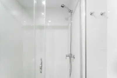 a shower with a glass door in a bathroom at Art Wine Loft with oPorto view! in Vila Nova de Gaia