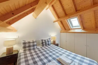 an overhead view of a wooden table with a couch at Orange Apartments B in Porto
