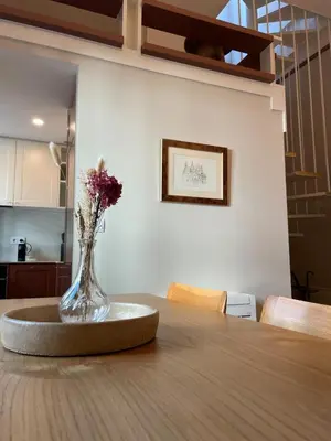 a vase of flowers sitting on top of a table at Casa de Duque de Loulé - Apartments by RealuptownPorto in Porto
