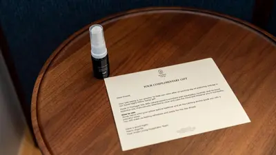 a diploma and a pen on a wooden table at Ando Living - São Miguel House in Porto