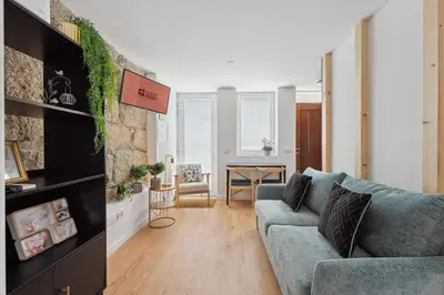 a living room with a couch and a table at GuestReady - Enjoy Comfort in Porto in Porto