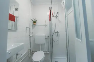 a bathroom with a shower and a toilet and a sink at Douro Garden Home Rooftop in Vila Nova de Gaia