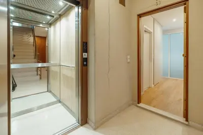 a room with a glass door and a hallway at Bright Window Apartment by Vacationy in Porto