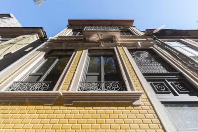 an ornate window on the side of a building at BO - Marquês Apartments in Porto