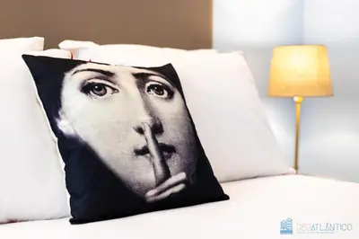 a pillow with a picture of a woman holding a instrument at Blu Constellation - Santa Catarina in Porto