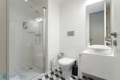 a bathroom with a toilet and a shower and a sink at Blu Constellation - Santa Catarina in Porto