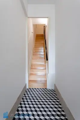 a hallway with a black and white checkered floor at Blu Constellation - Santa Catarina in Porto