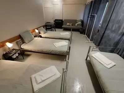 a bathroom with two sinks and a mirror at Porto Central Hostel in Porto