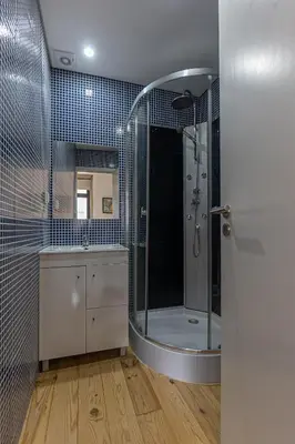 a bathroom with a shower and a sink at Studio Apartment Torrinha in Porto