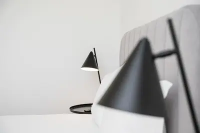 a black and white lamp sitting next to a wall at GuestReady - A fantastic home in Porto in Porto