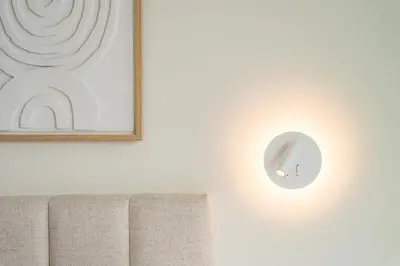 a lightswitch on a white wall with a picture at GuestReady - DPV Residences in Porto