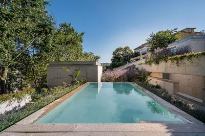 a swimming pool in the yard of a house at GuestReady - DPV Residences in Porto