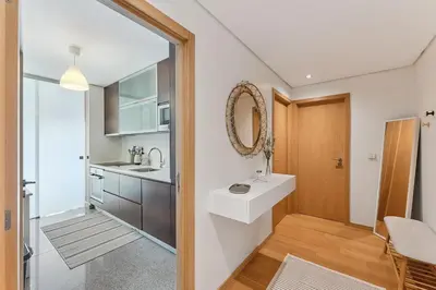 a bathroom with a sink and a mirror at GuestReady - Modern apartment in Boavista in Porto