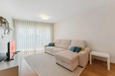a living room with a couch and a table at GuestReady - Modern apartment in Boavista in Porto