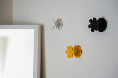 two magnets on the side of a white refrigerator at GuestReady - Modern apartment in Boavista in Porto