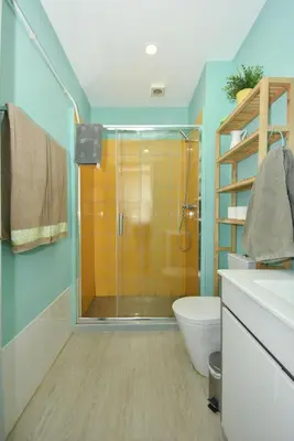 a bathroom with a shower with a toilet and a sink at Art & City in Porto