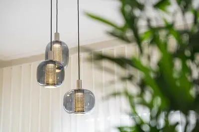 a group of three lights hanging from a ceiling at GuestReady - Porto stay with outdoor charm in Porto