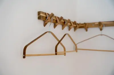 a wooden coat rack with three metal hooks at GuestReady - Porto stay with outdoor charm in Porto