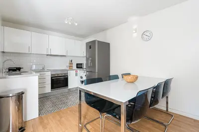 a kitchen with a table and chairs in a room at GuestReady - Relaxing getaway in Santos Pousada in Porto