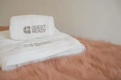 a close up of a persons arm with a towel on top at GuestReady - Urban paradise in Porto in Porto