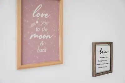 a framed picture of love and you to the moon and back and a mirror at GuestReady - Urban paradise in Porto in Porto