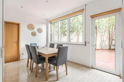 a dining room with a table and chairs at GuestReady - Central & spacious apartment in Porto in Porto