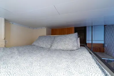 a bedroom with a large bed in a room at Microloft in the heart of Porto in Porto
