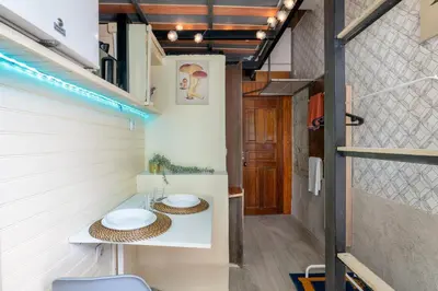a small bathroom with two sinks in a tiny house at Microloft in the heart of Porto in Porto