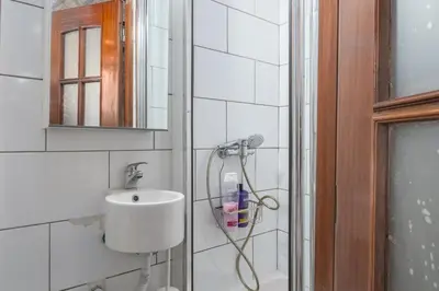 a bathroom with a shower and a sink at Microloft in the heart of Porto in Porto