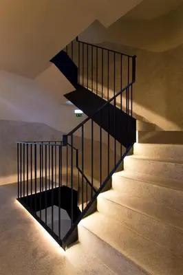 a staircase with a black railing in a house at Porto - Boavista Casa Da Música- Art Gallery Apartment III in Porto