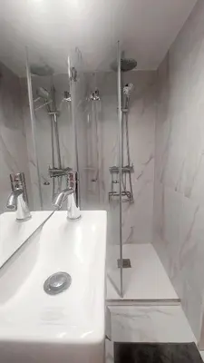 a white bathroom with a shower and a sink at Casa dos Moinhos - Country House in Porto City in Porto