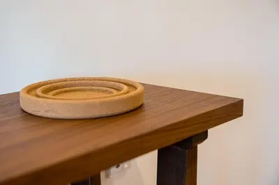 a wooden table with a bowl on top of it at GuestReady - Cheerful place in Porto in Porto