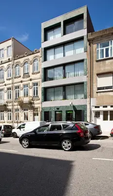 a black car parked in front of a building at Porto - Boavista Casa Da Música - Art Gallery Apartment I in Porto