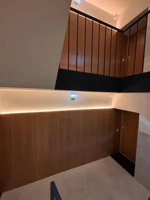 a room with a staircase with wooden cabinets at Porto - Boavista Casa Da Música - Art Gallery Apartment I in Porto