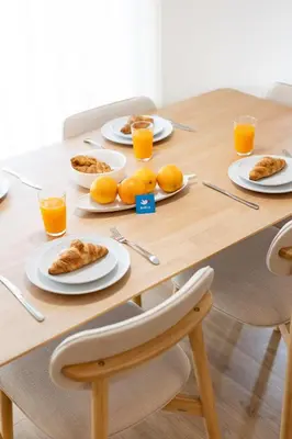 a living room with a table and a couch at Urban Comfort @ Bonfim Boutique Flats in Porto