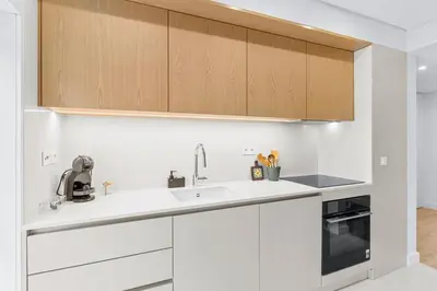 a dining room and kitchen with a table and chairs at Urban Comfort @ Bonfim Boutique Flats in Porto