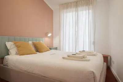 a bedroom with a bed with towels on it at Liiiving in Porto - Downtown Comfort House in Porto